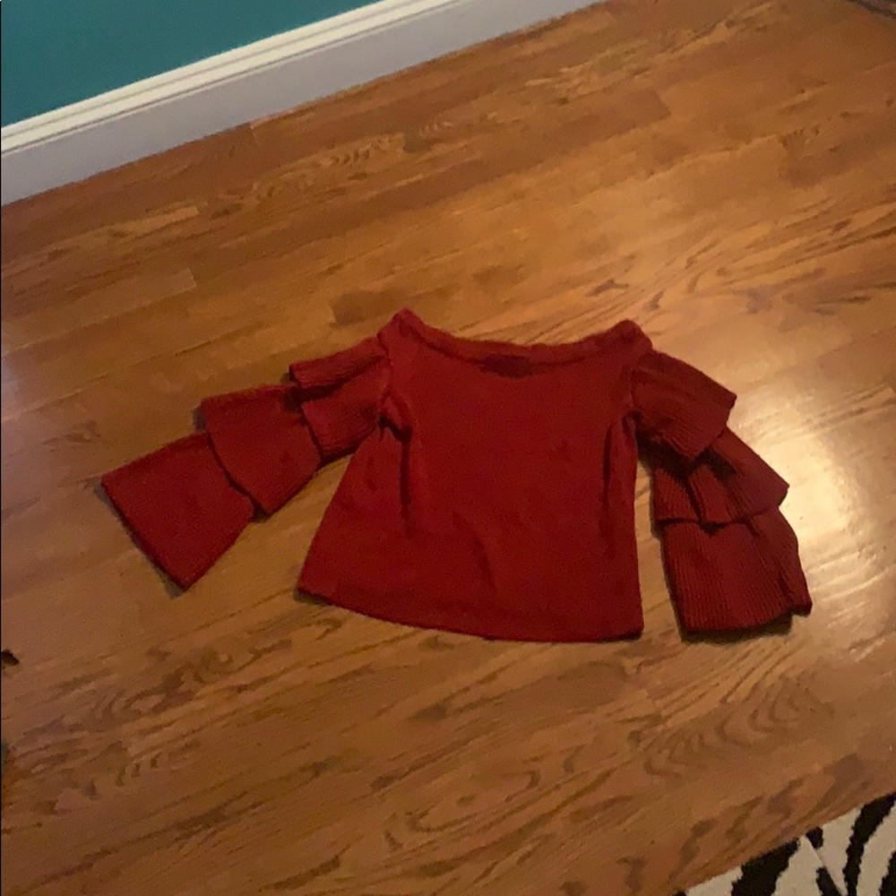 Red ruffle and flared sweater.